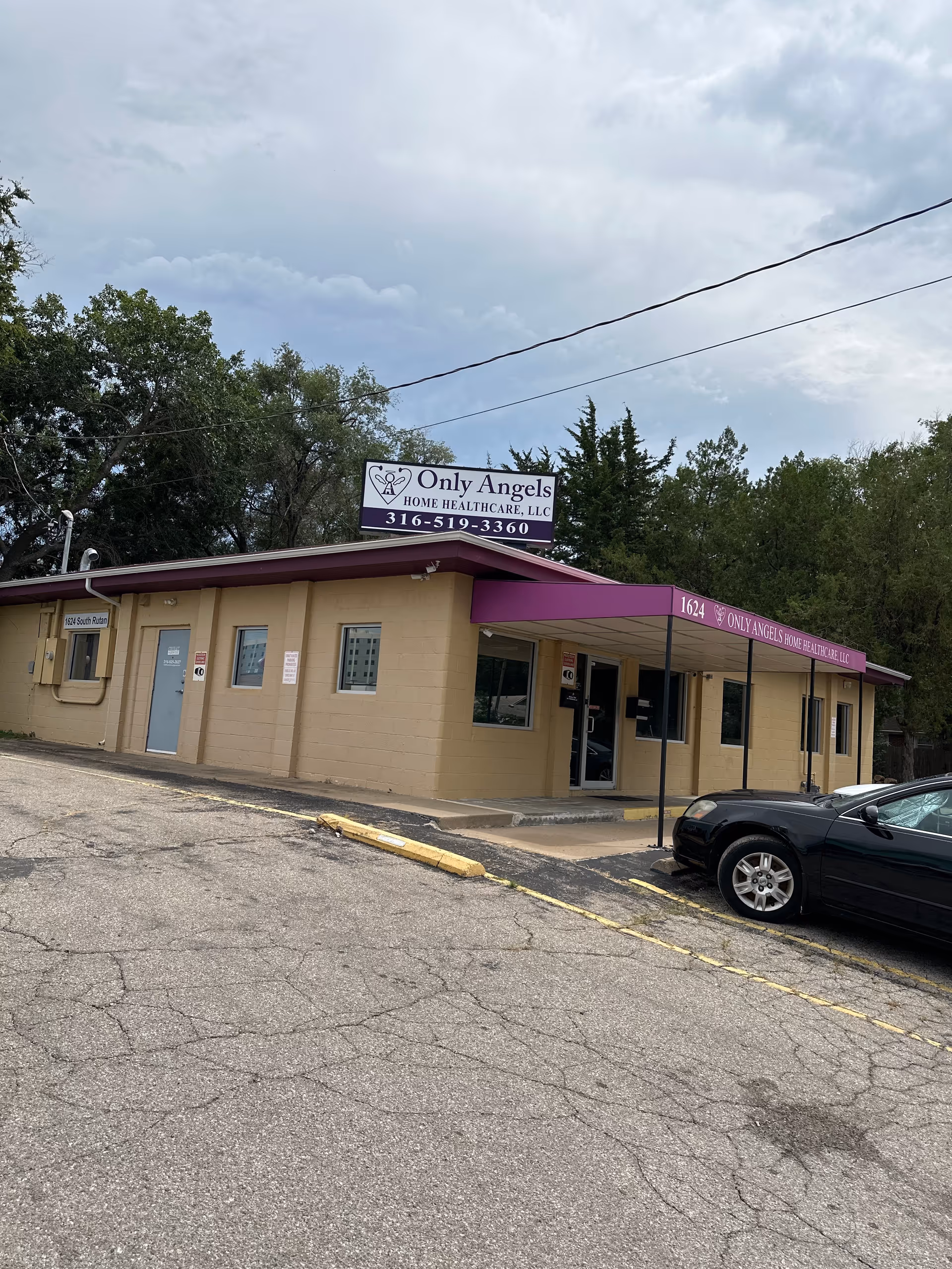 The front view shows building with purple canopy and Only Angels Home Health Care sign.