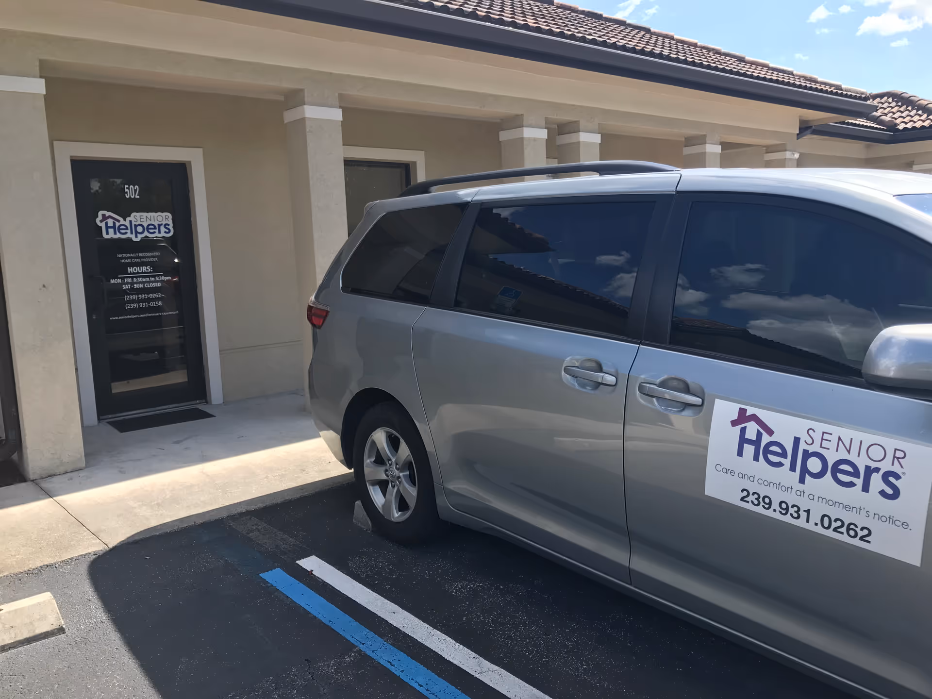 Exterior view of Senior Helpers Fort Myers & Cape Coral facility with parked van.