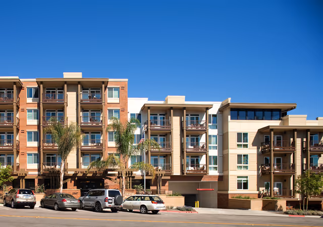 Exterior view of Merrill Gardens at Bankers Hill, a multi-story senior living building