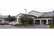 Front exterior view of Enterprise Health & Rehabilitation Center with a parking lot and entrance.