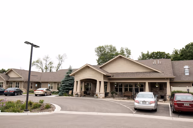Front exterior view of Home Again Assisted Living Columbus with parked cars.