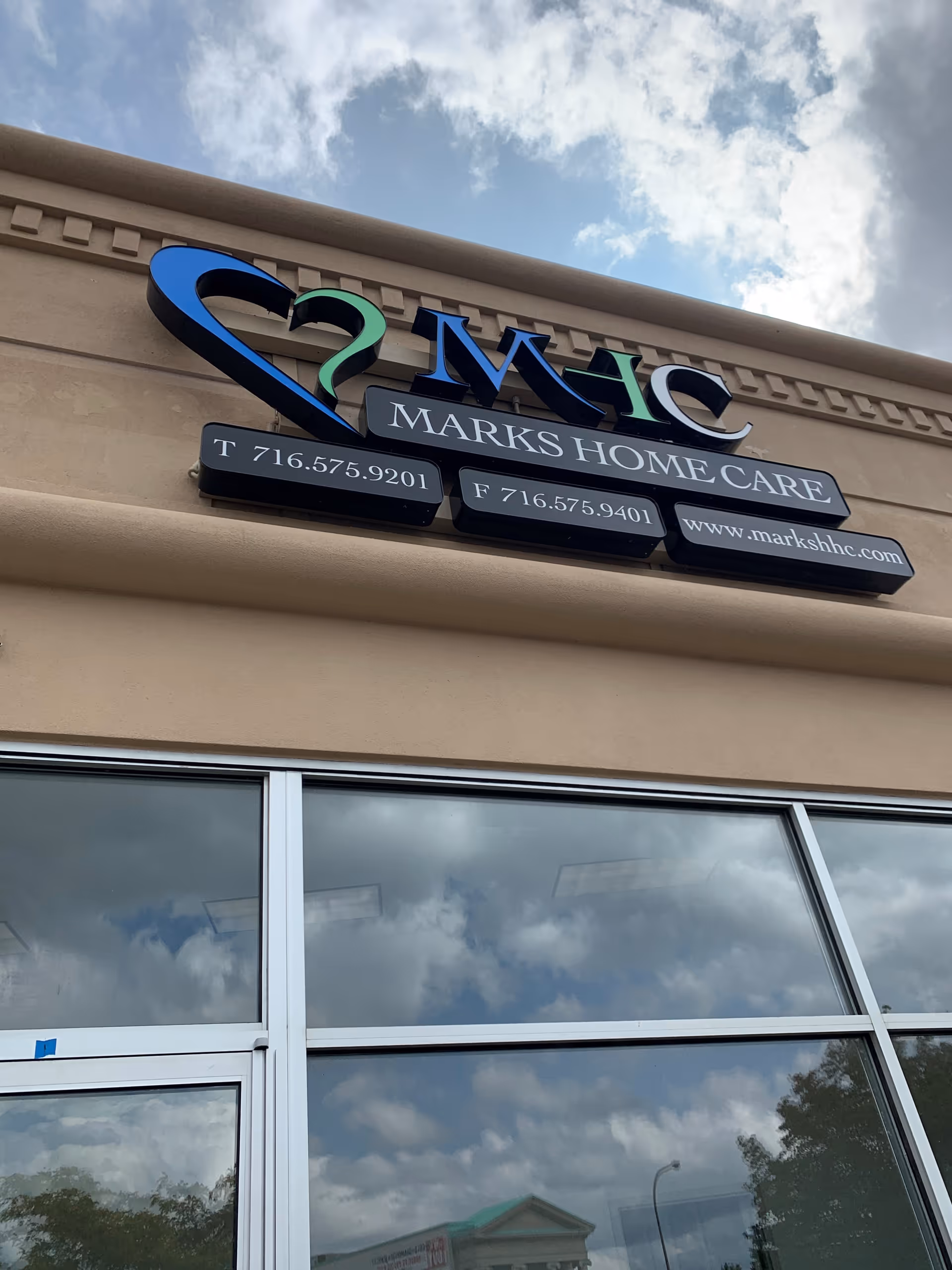 Front facade of a building with Marks Home Care sign and logo.