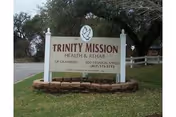 Front yard sign for Trinity Mission Health & Rehab of Granbury.