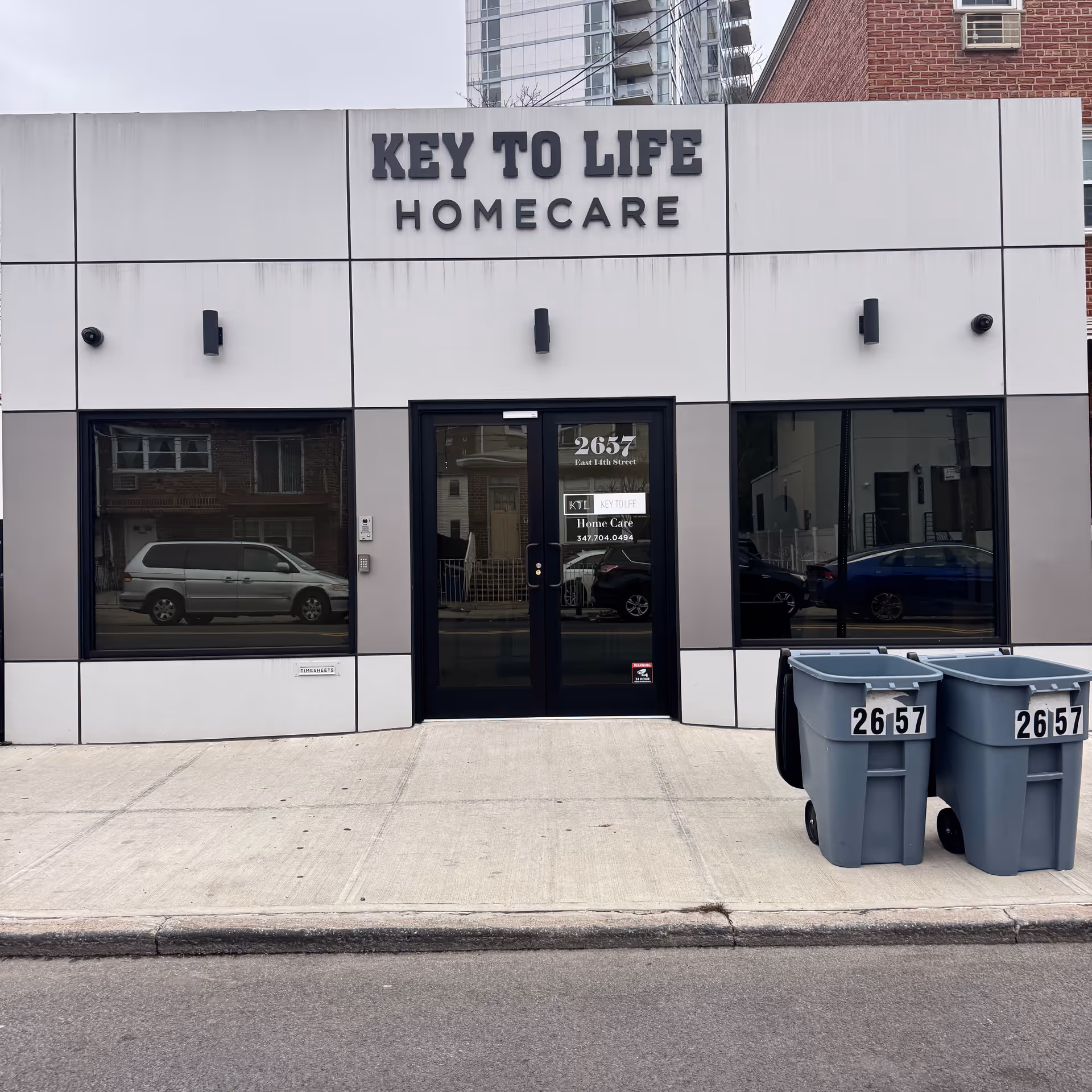 Front exterior of Key to Life Homecare building with glass doors facing the street.