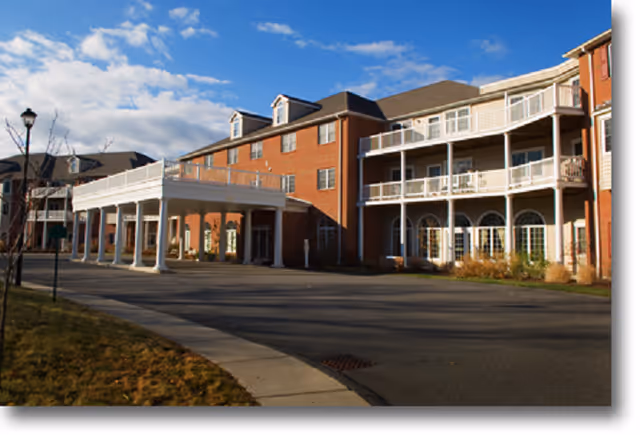 Exterior view of The Wellington at Springfield with brick building and covered entrance.