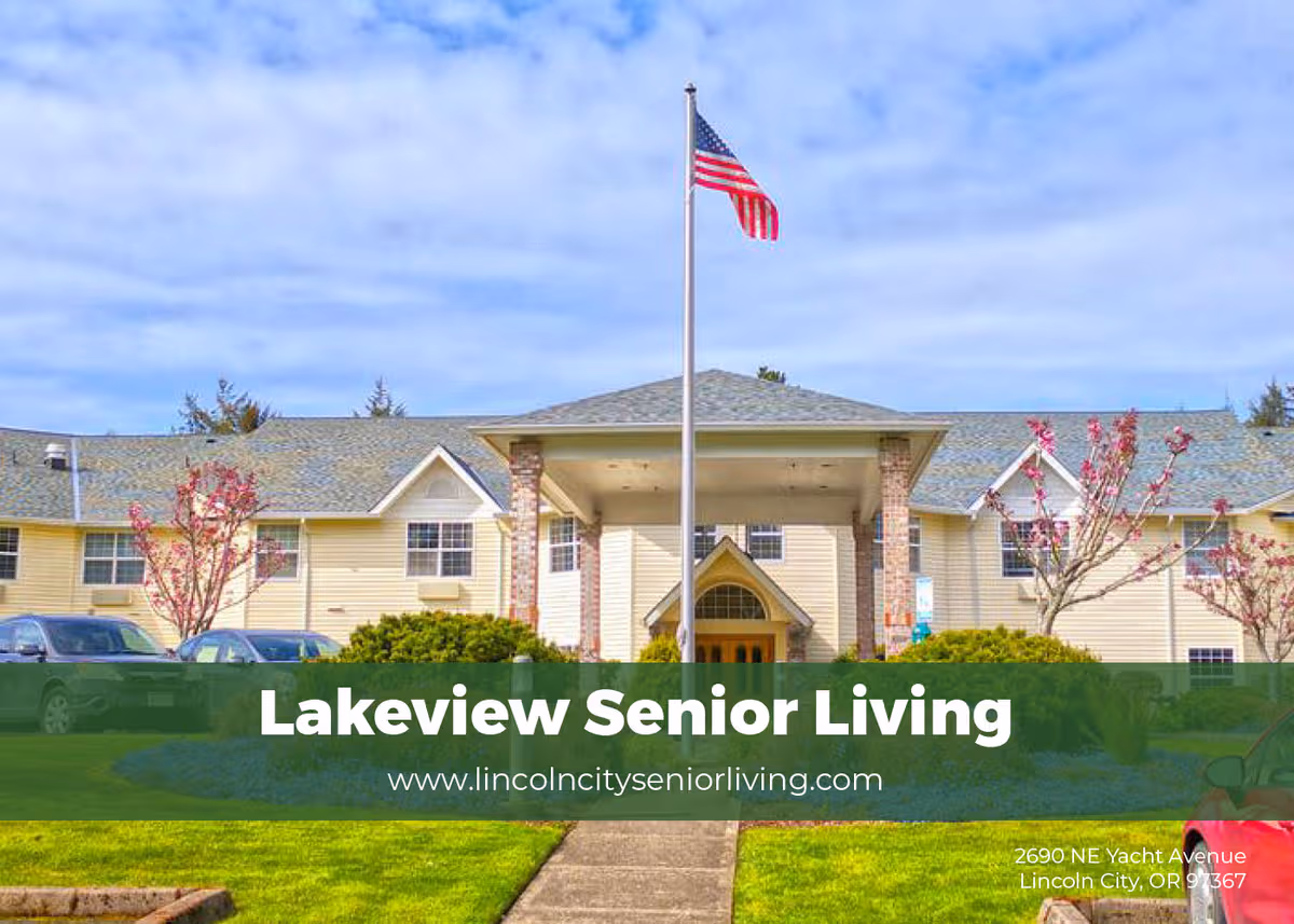 Exterior view of a beige senior living facility with a flagpole and well-kept lawn.