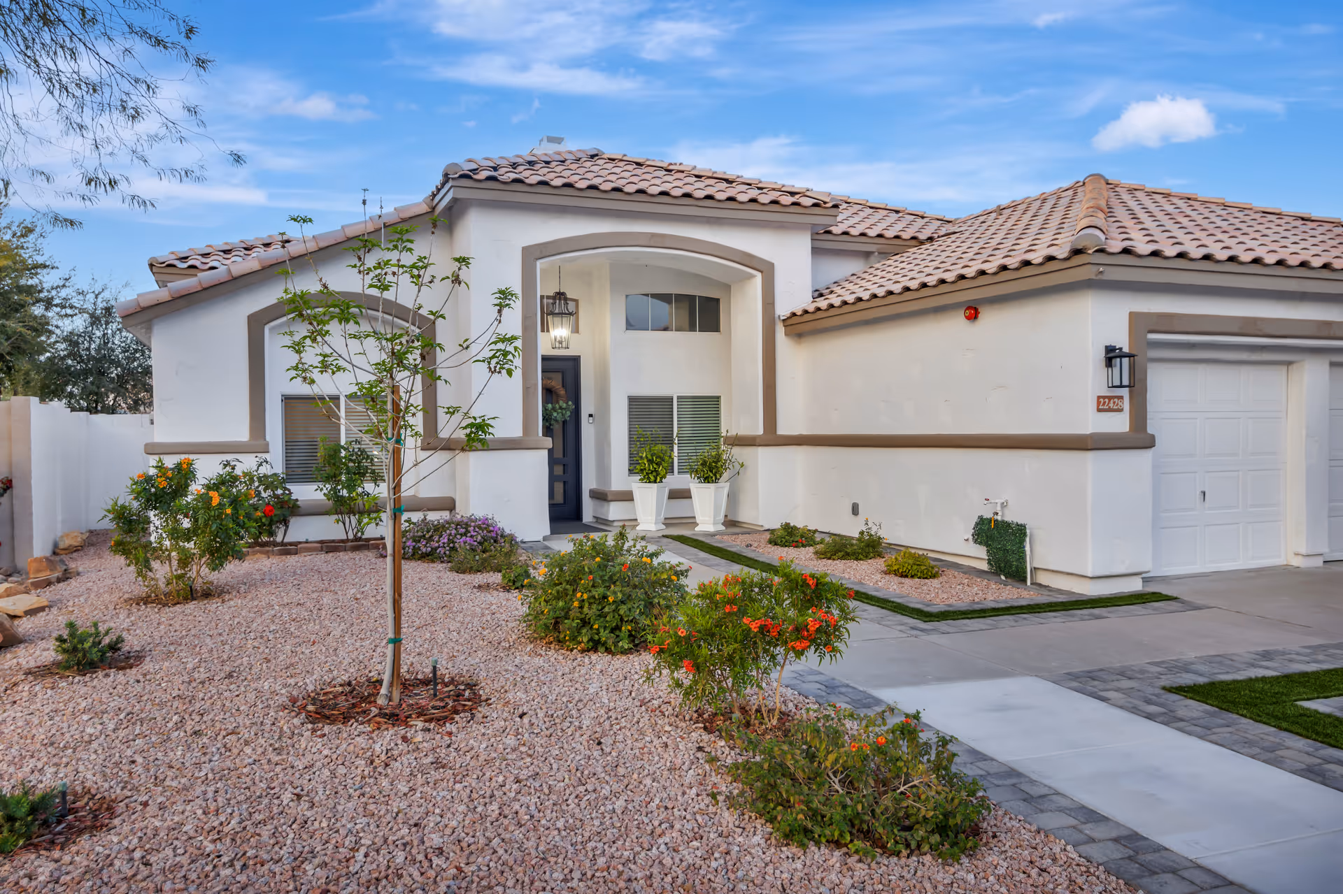 Front view of Mountain Laurel Assisted Living building with desert landscaping and a welcoming entrance