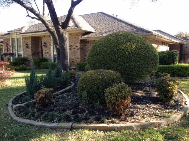 Exterior of Mission Ridge Residential Care with brick walls and a landscaped circular garden.