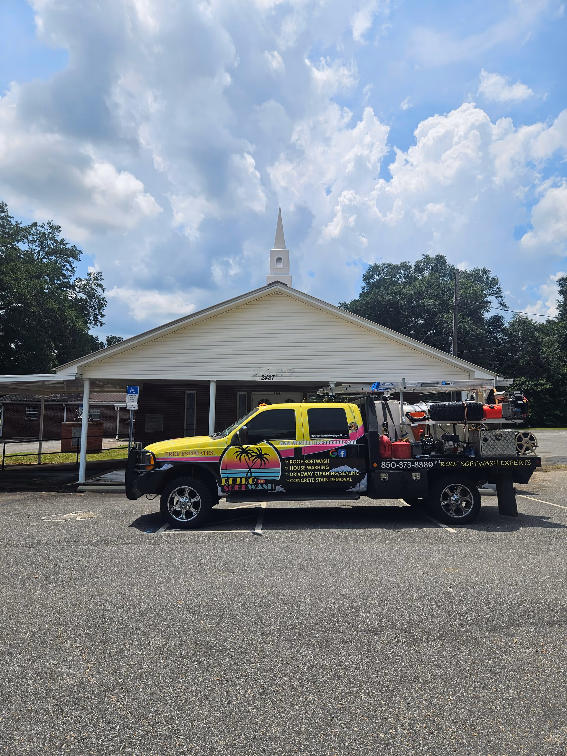 Front view of Serenity Homecare Services facility with a colorful service truck parked.