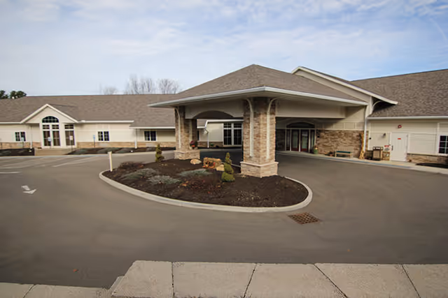 Exterior view of Brookdale Vestal West with circular driveway and covered entrance.