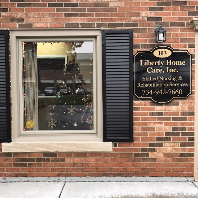Brick exterior with a window and Liberty Home Care, Inc. sign on the wall.