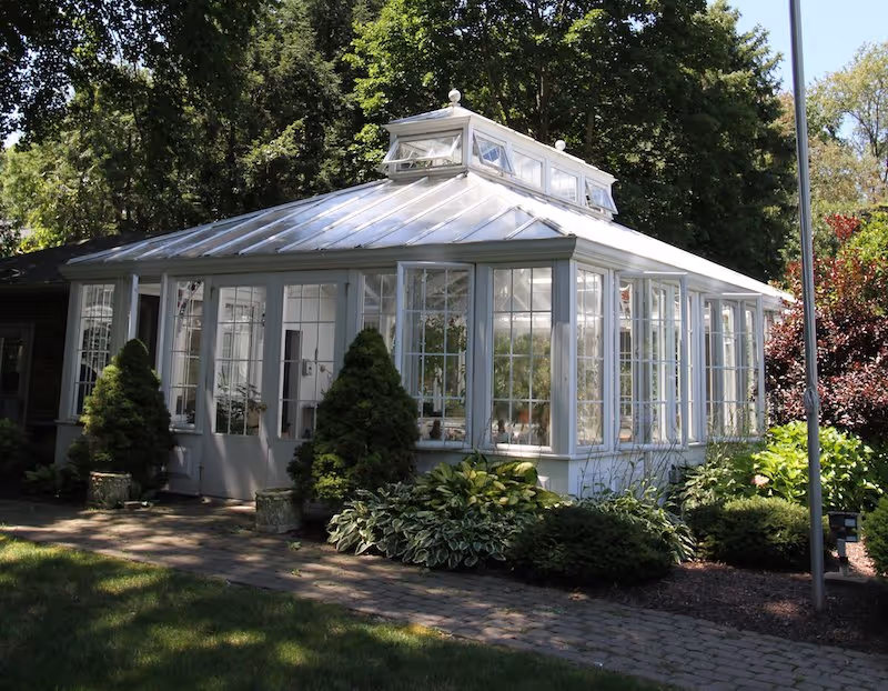Front view of a glass conservatory at a senior living facility.