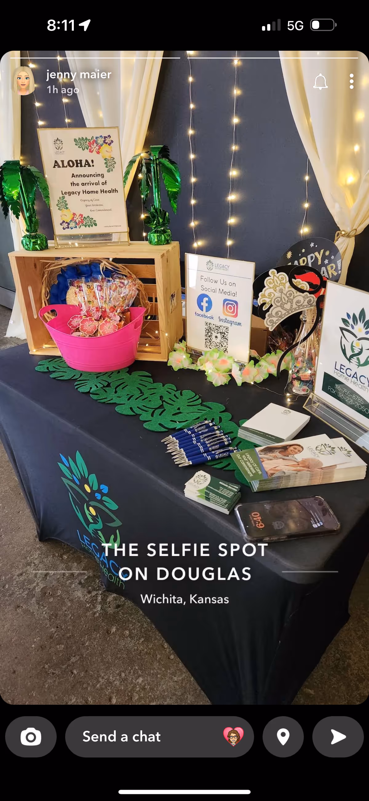Promotional booth for Legacy Home Health with brochures, signs, and decorative lighting.