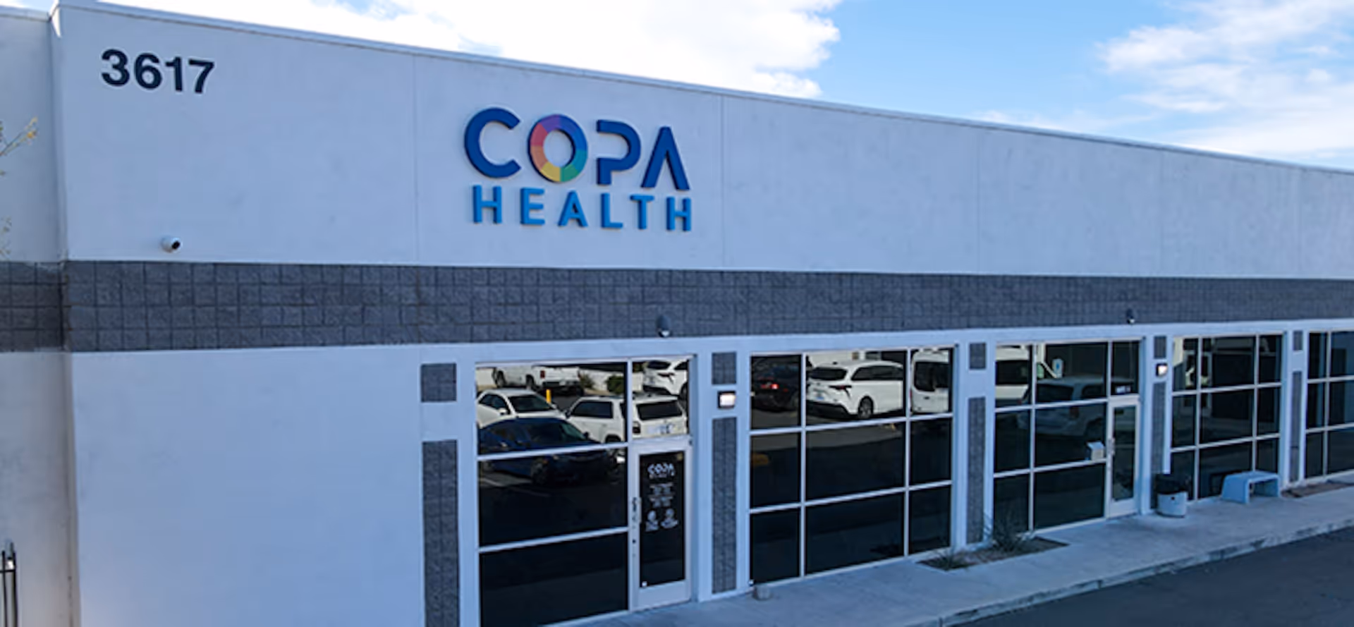 Copa Health Cambridge Campus building frontage with large blue sign.