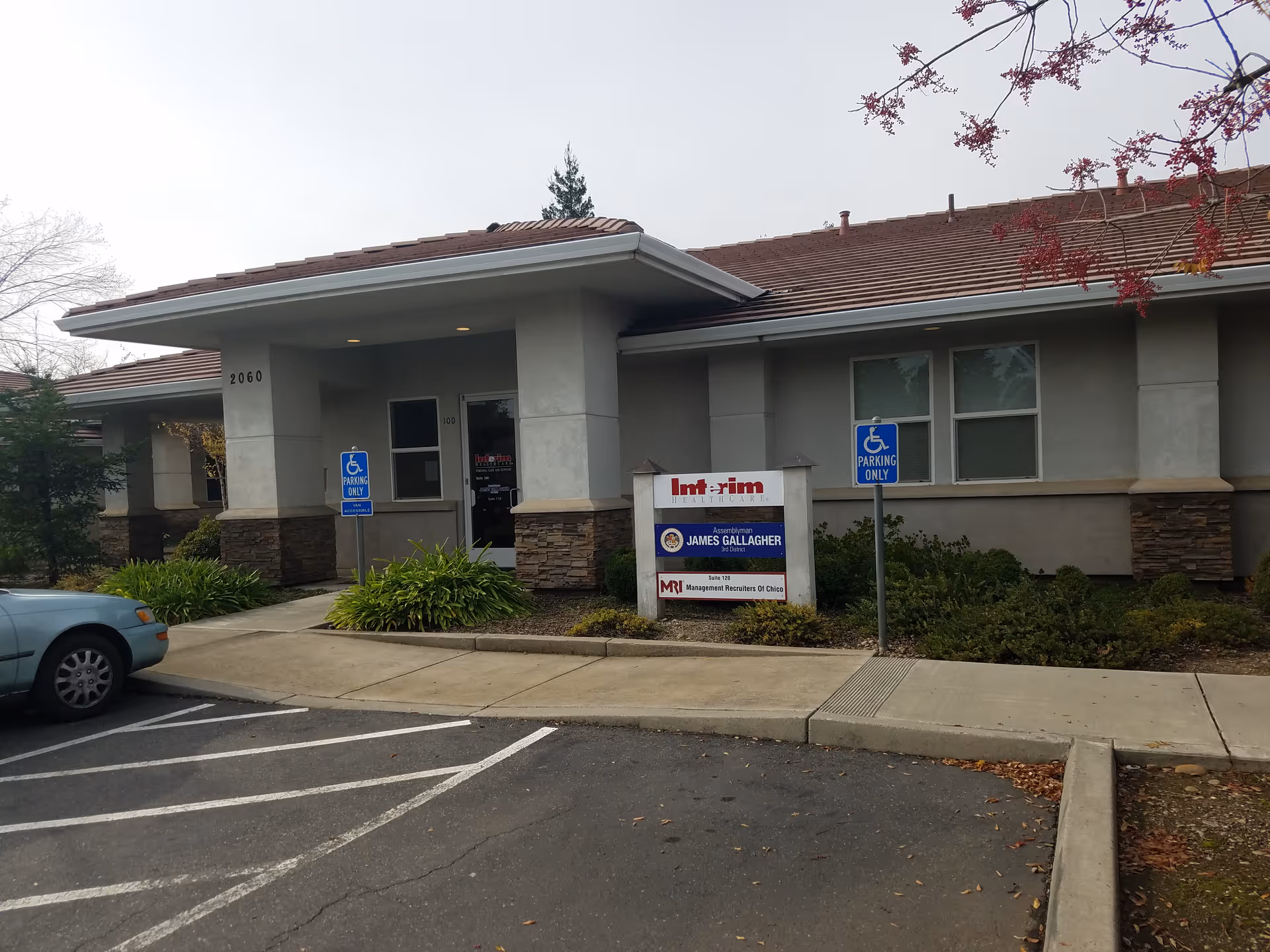 Exterior view of Interim HealthCare of Chico facility with entrance and parking.