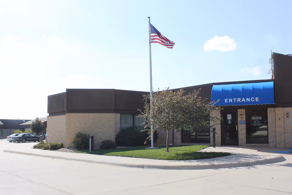 Exterior view of York General West View Medical Building with blue entrance awning and flag