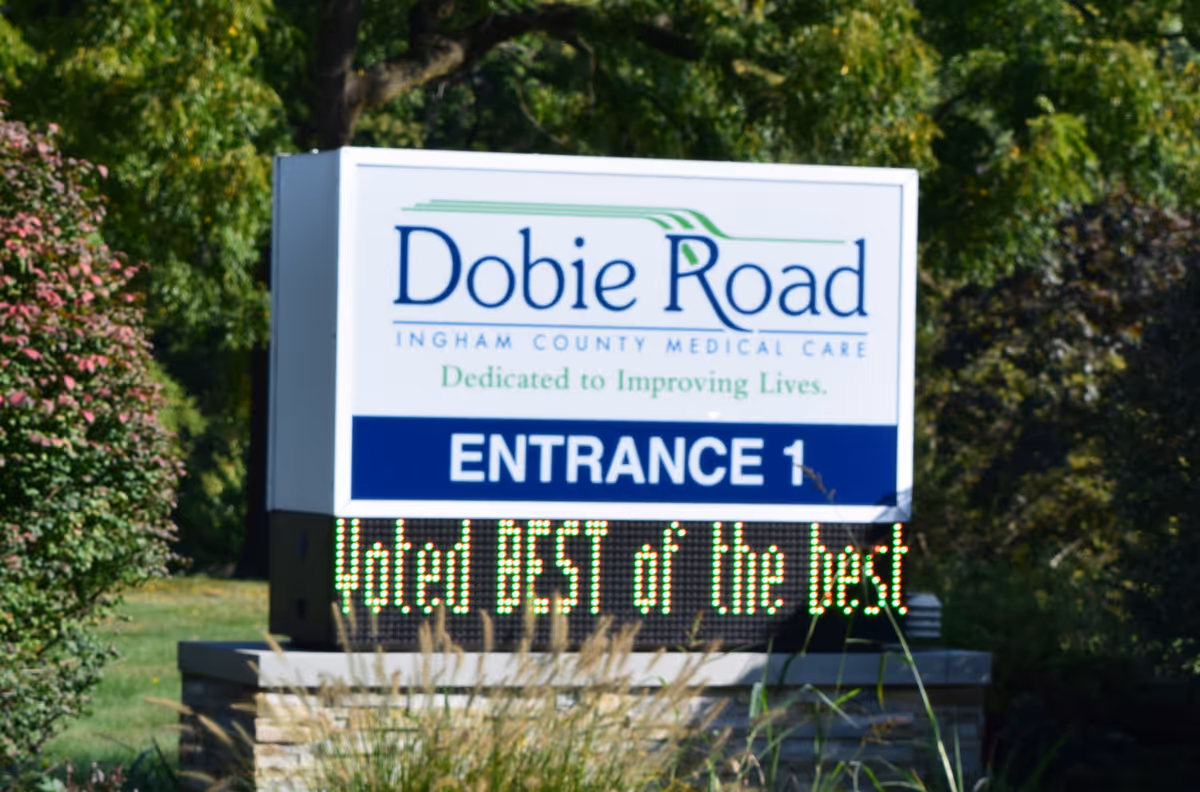 Outdoor sign for Dobie Road, Ingham County Medical Care Facility, Entrance 1.