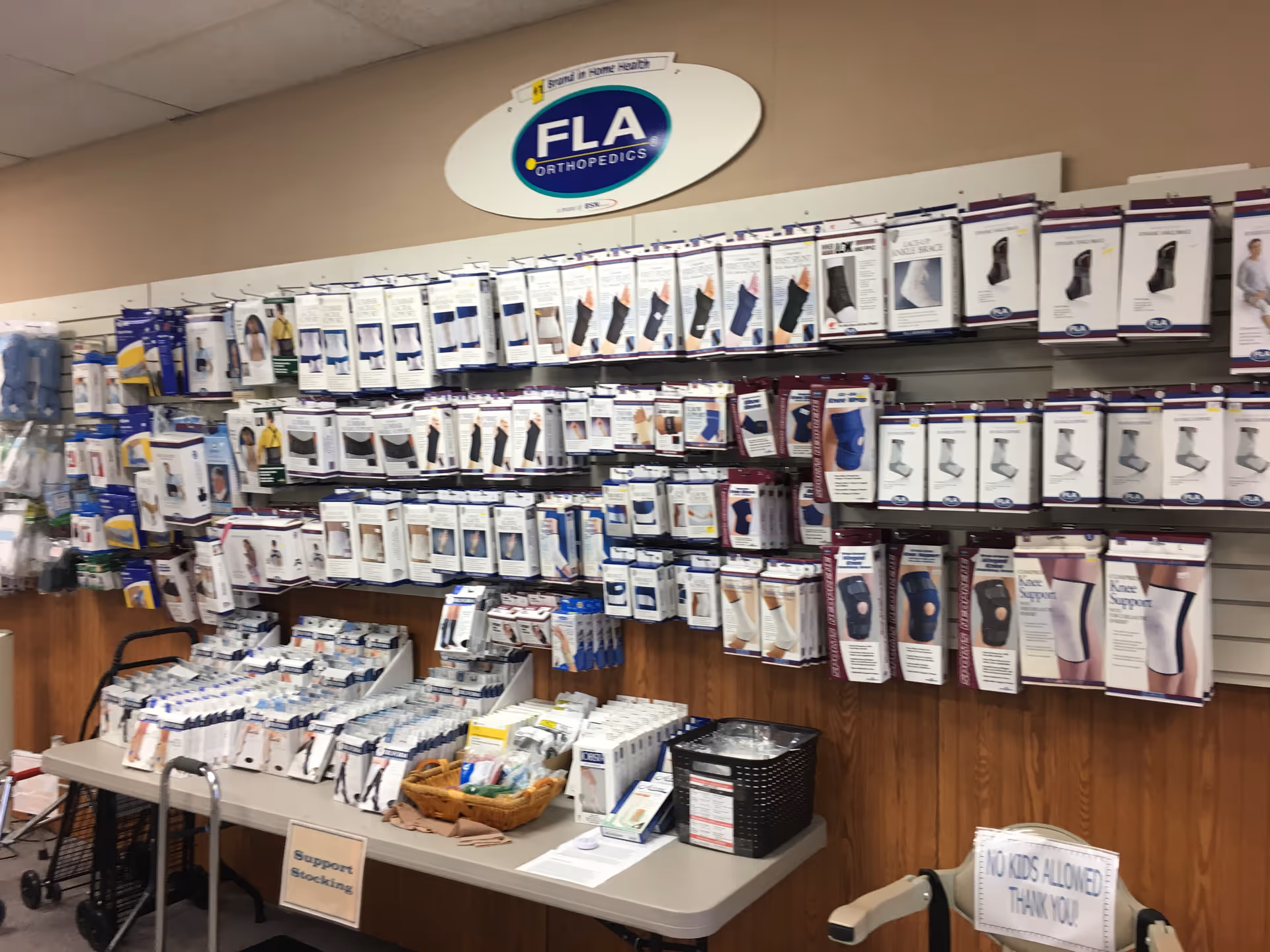 Inside a home health equipment store with shelves of braces, supports, and walkers.