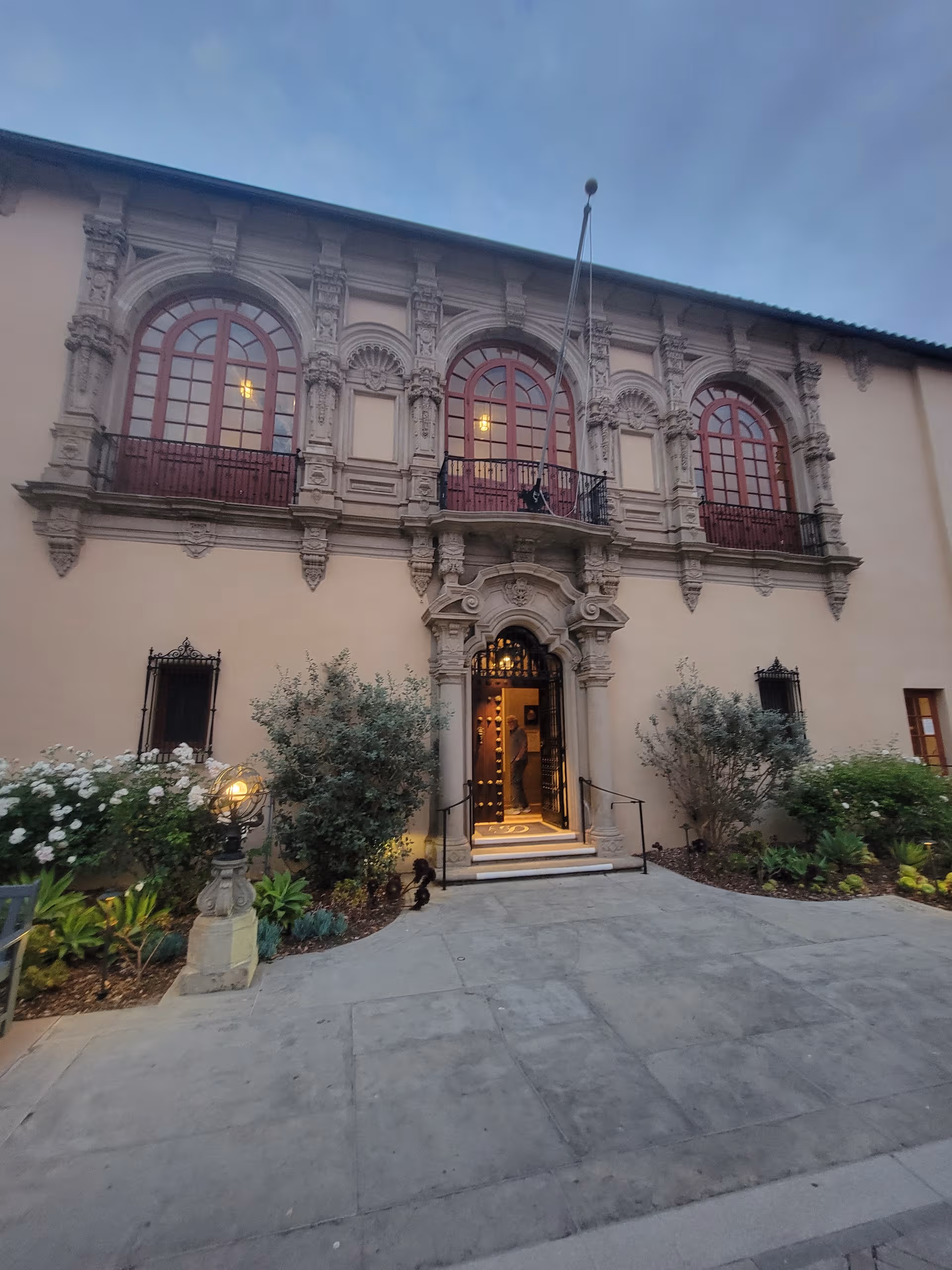 Ornate exterior of Casa Dorinda with arched windows and a grand stone entrance.