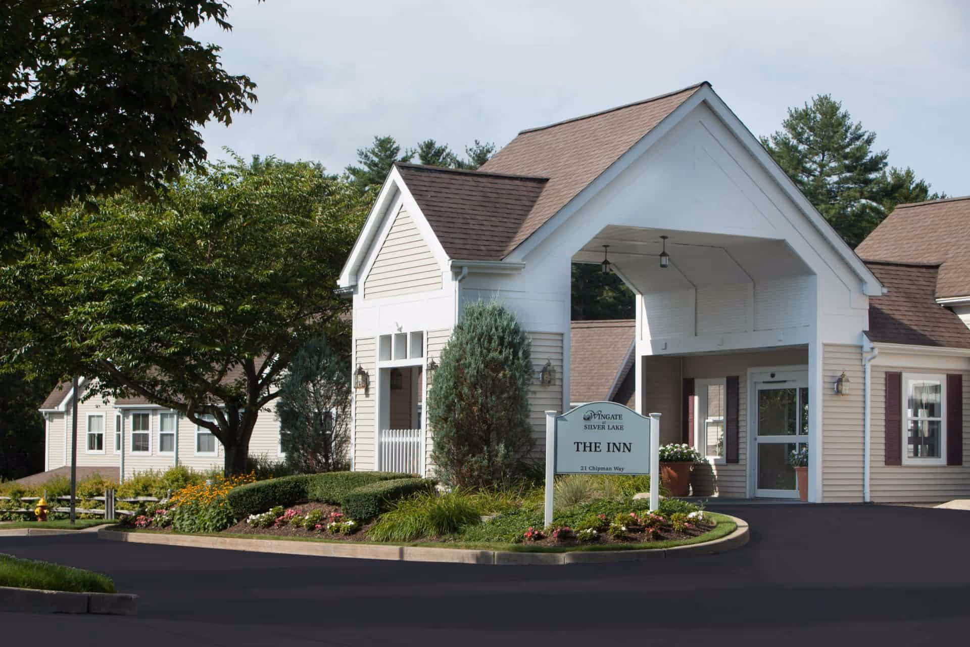 Exterior view of Wingate Residences at Silver Lake entrance with landscaped surroundings.