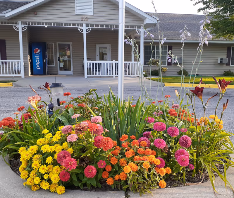 Colorful flower bed in front of Park Lane Estates Assisted Living entrance.