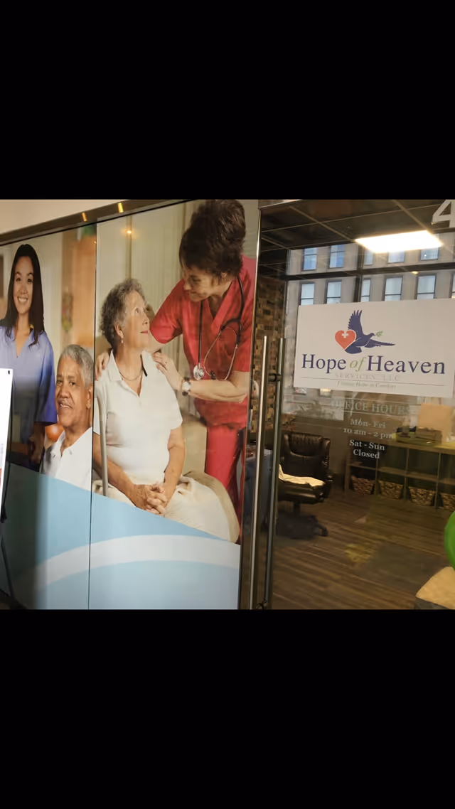 Lobby interior of Hope of Heaven facility with large wall mural and entrance sign.