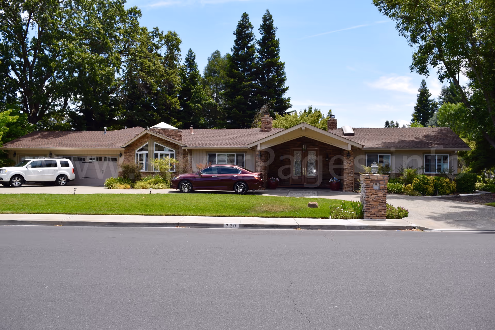 Single-story senior residence with a brick entry and front driveway.