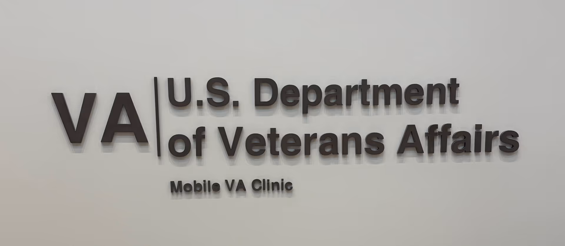 Interior wall sign reads U.S. Department of Veterans Affairs Mobile VA Clinic.