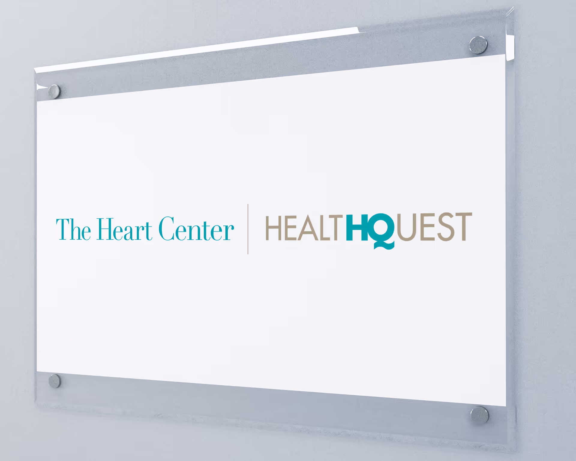A wall-mounted sign displays The Heart Center and HealthQuest logos.