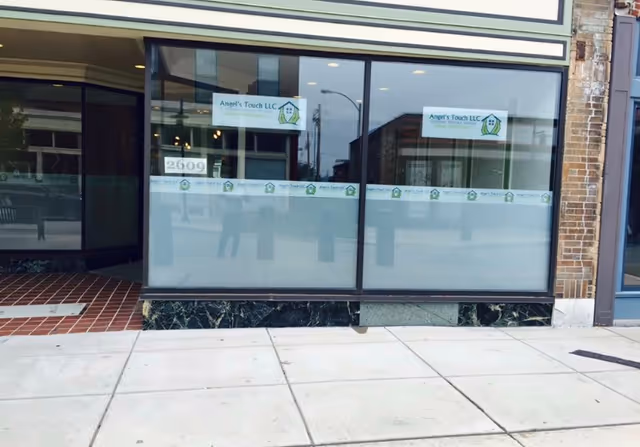 Exterior storefront of Angel's Touch Home Healthcare with large glass windows and a sidewalk.