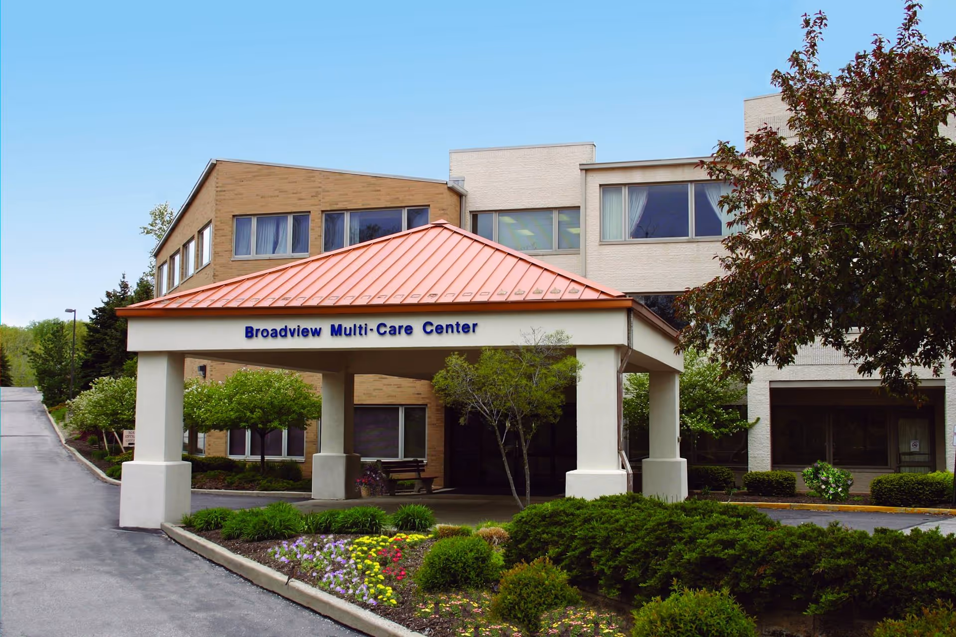 Front view of Broadview Multi-Care Center with a covered entrance and landscaped walkway.