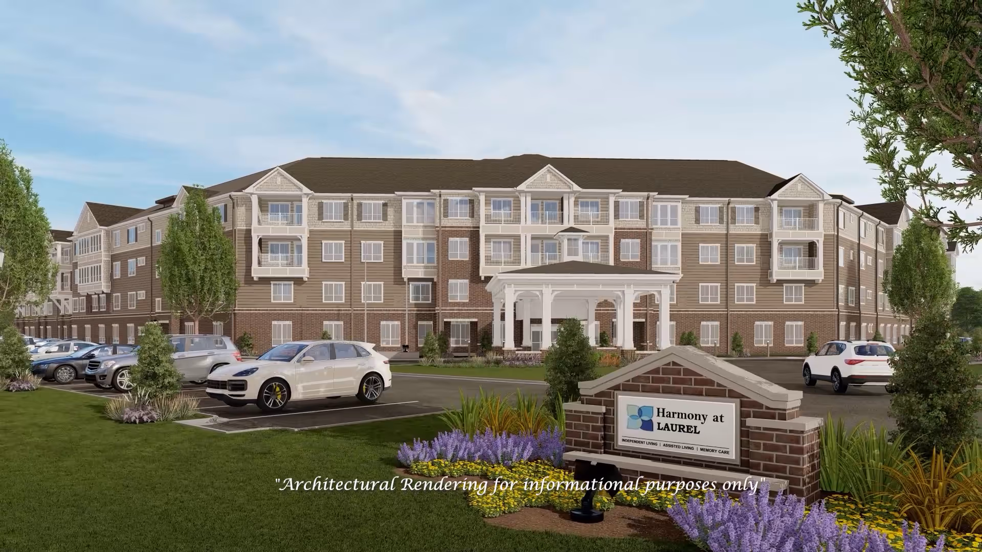 Exterior view of Harmony at Laurel senior living facility with parking and landscaping.