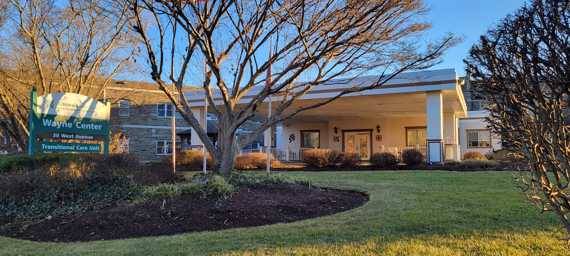 Exterior view of Wayne Center facility with entrance and landscaped front yard.