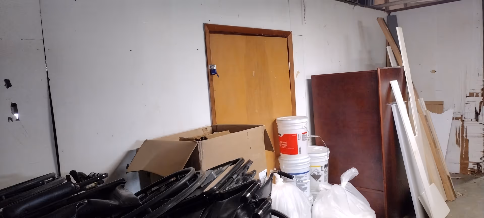 Cluttered indoor maintenance room at Apple Ridge Care Center with materials and tools strewn about.