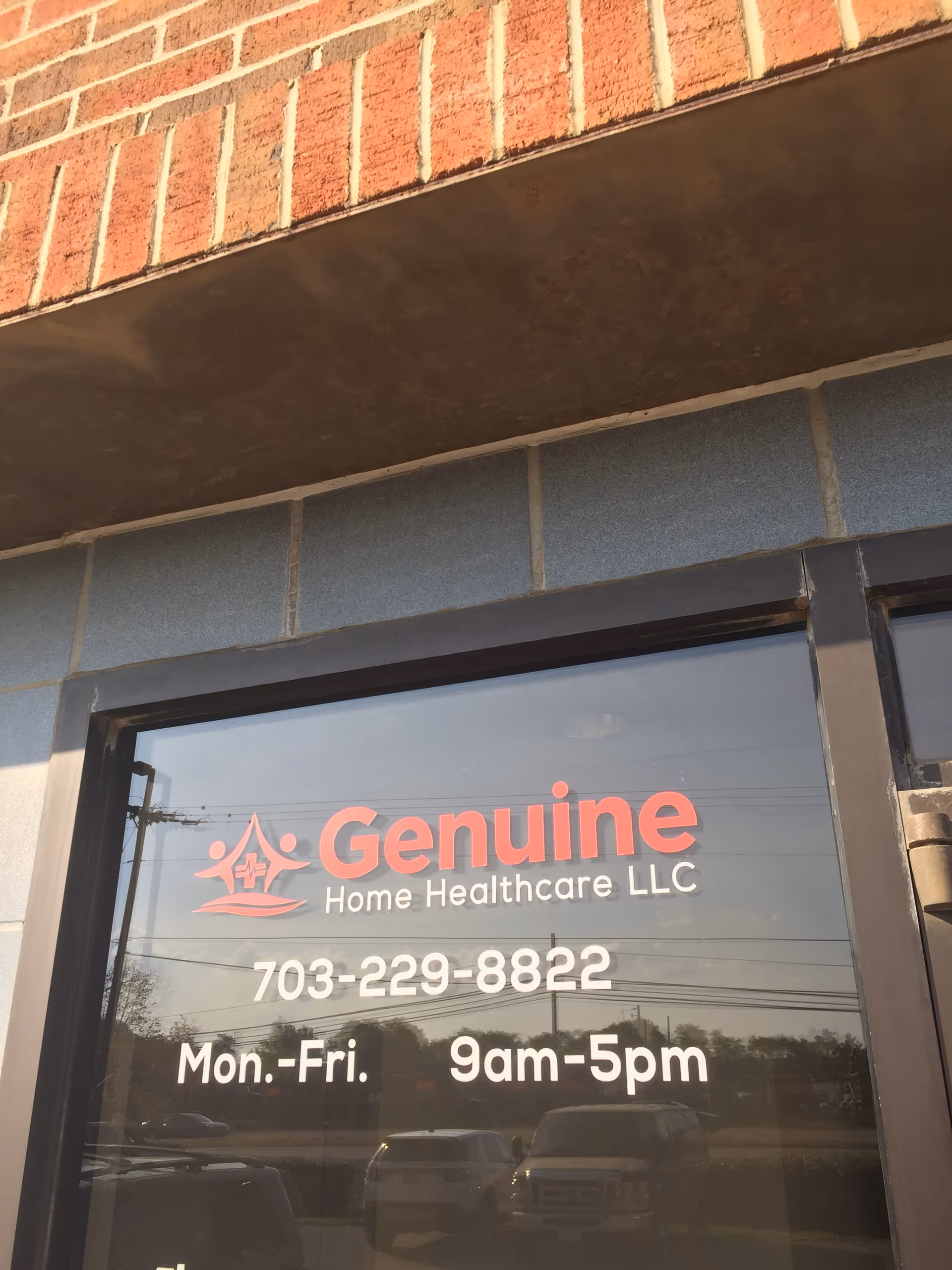 Glass storefront door with Genuine Home Healthcare LLC sign and phone number.