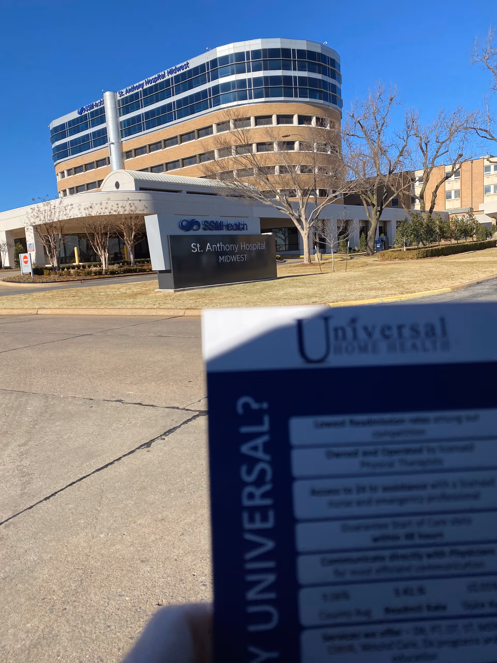 Exterior view of a modern hospital with St. Anthony Hospital Midwest signage and Universal card.