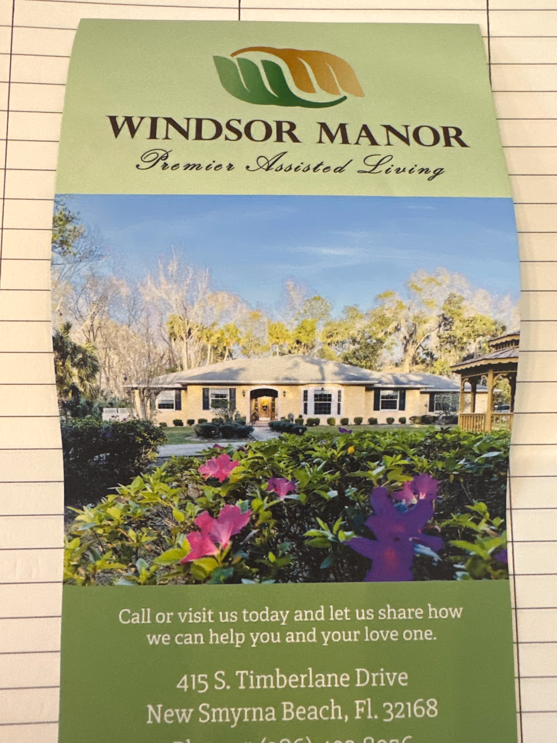 Pamphlet cover shows Windsor Manor assisted living building with a landscaped front yard.