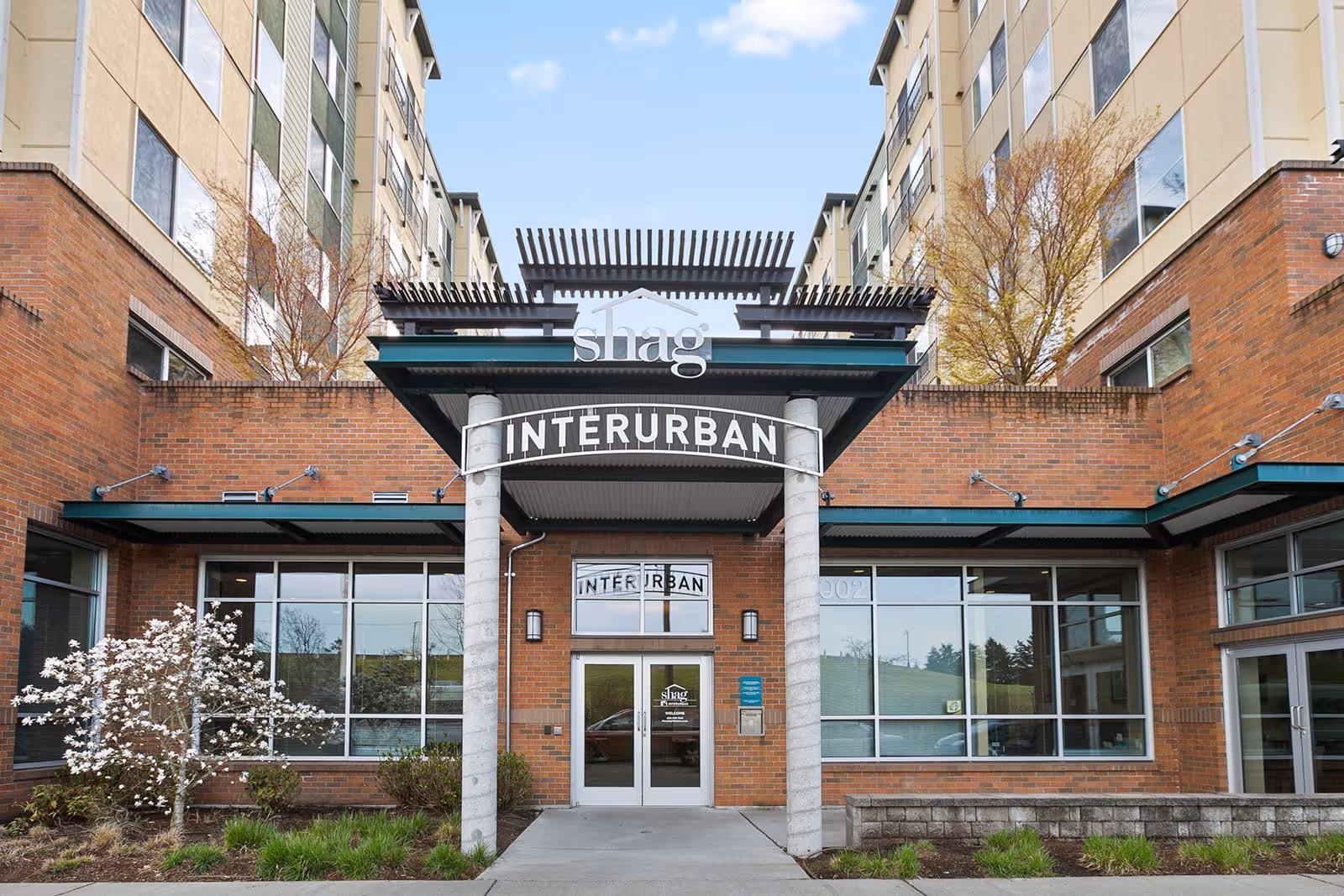 Exterior view of Interurban Senior Living entrance with brick building and canopy.