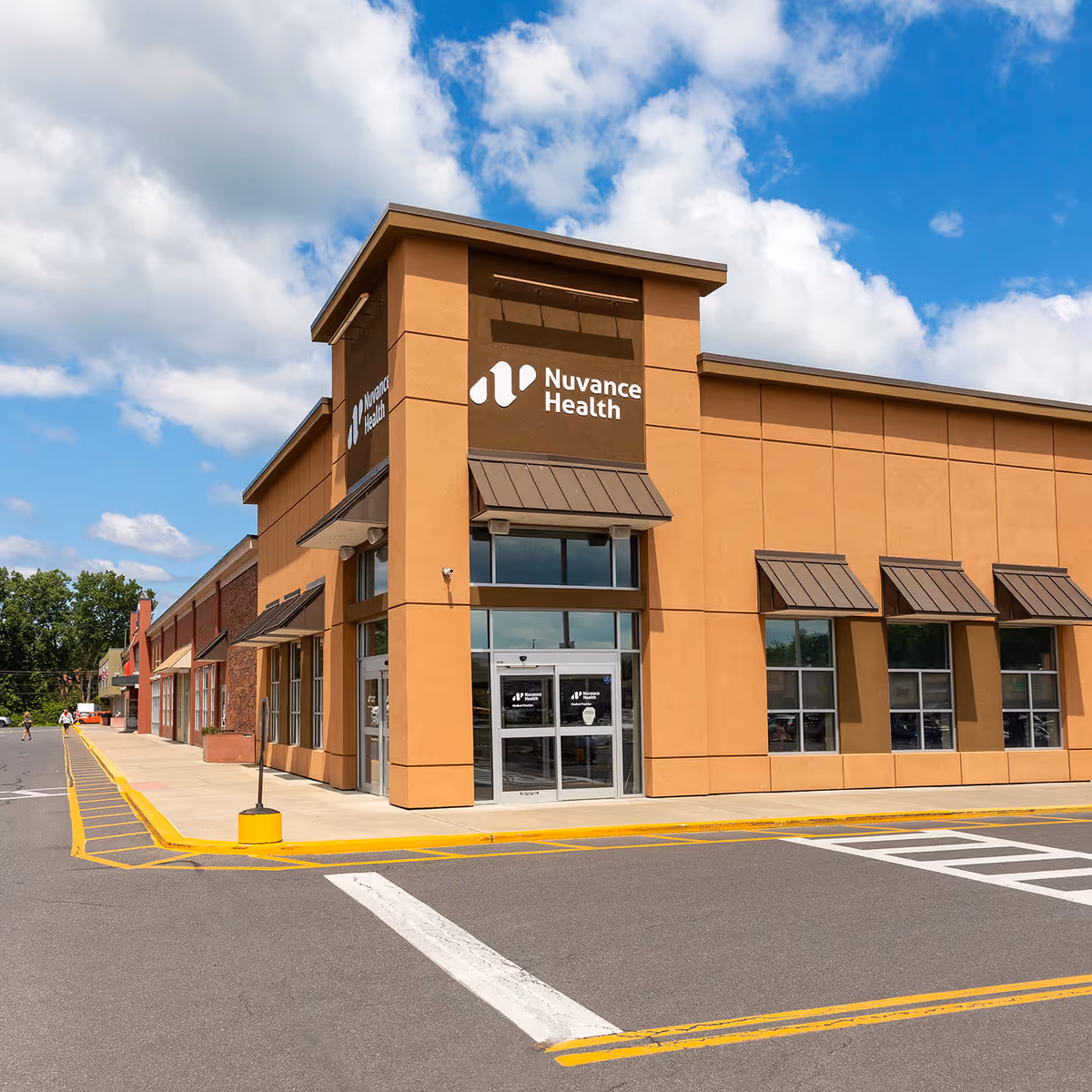 Exterior view of Nuvance Health Medical Practice building with signage and parking lot.