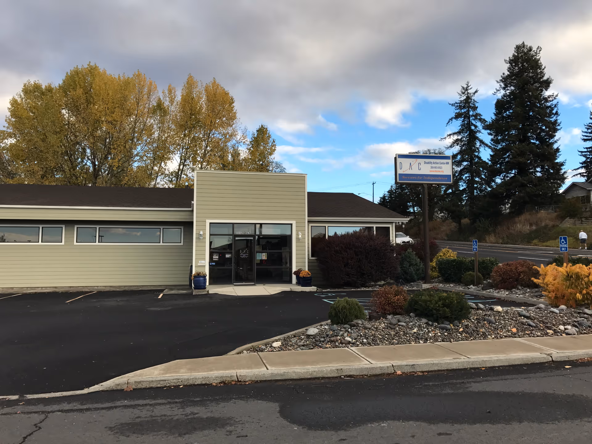Front view of Disability Action Center NW, Inc. building with parking area.