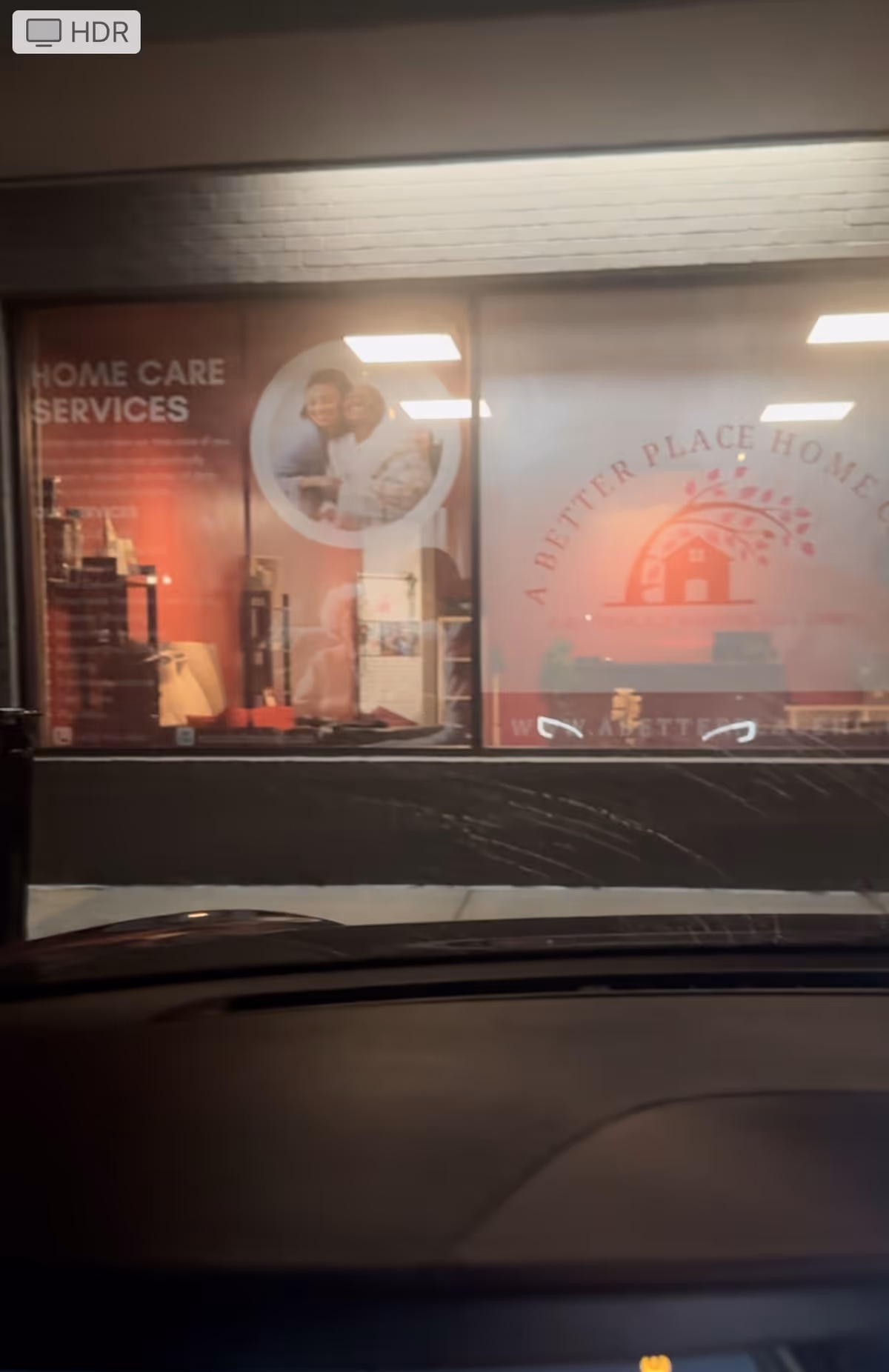 A Better Place Home Care storefront signage visible through glass