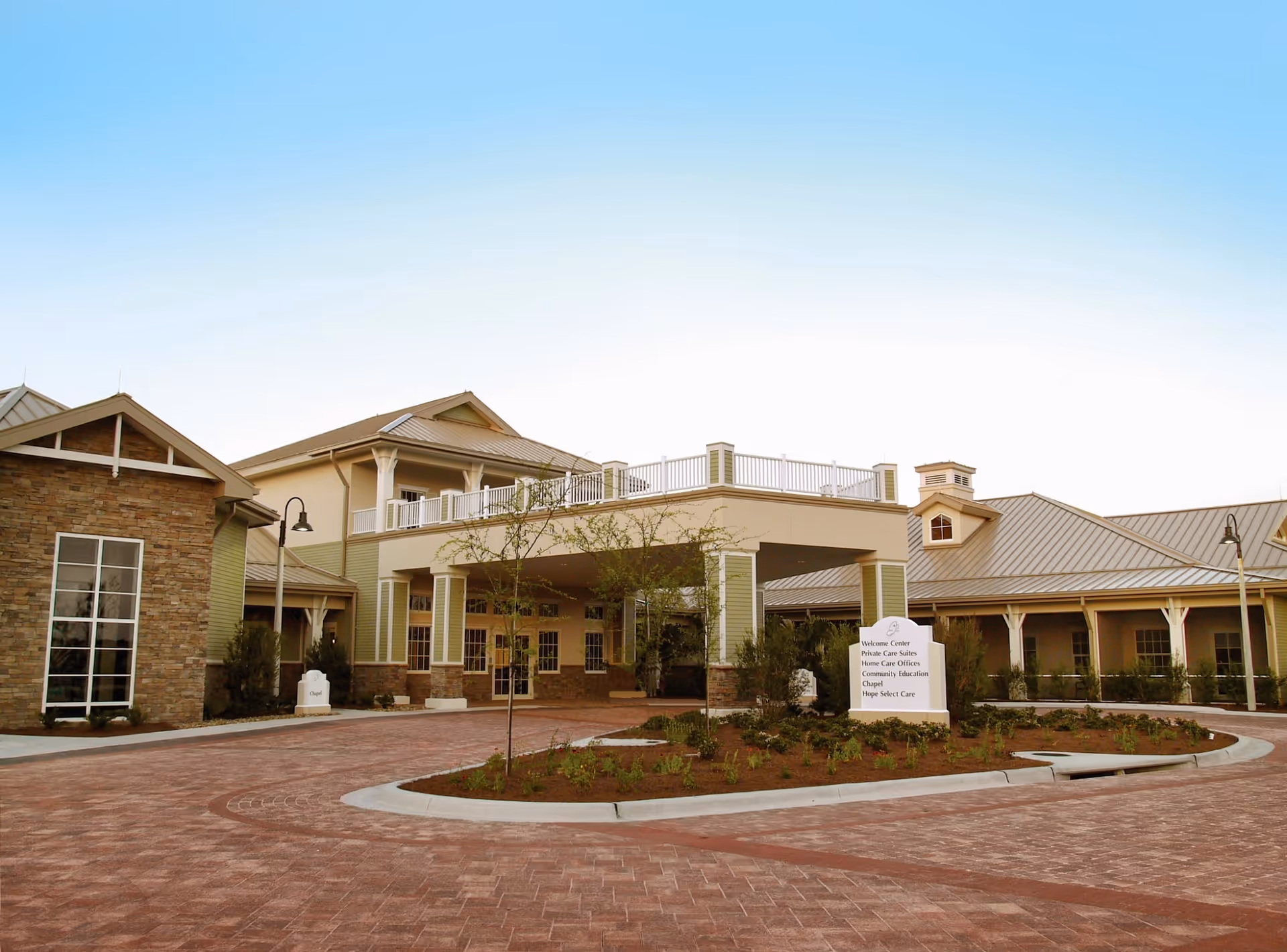 Hope Hospice exterior building with brick driveway and landscaped entry.