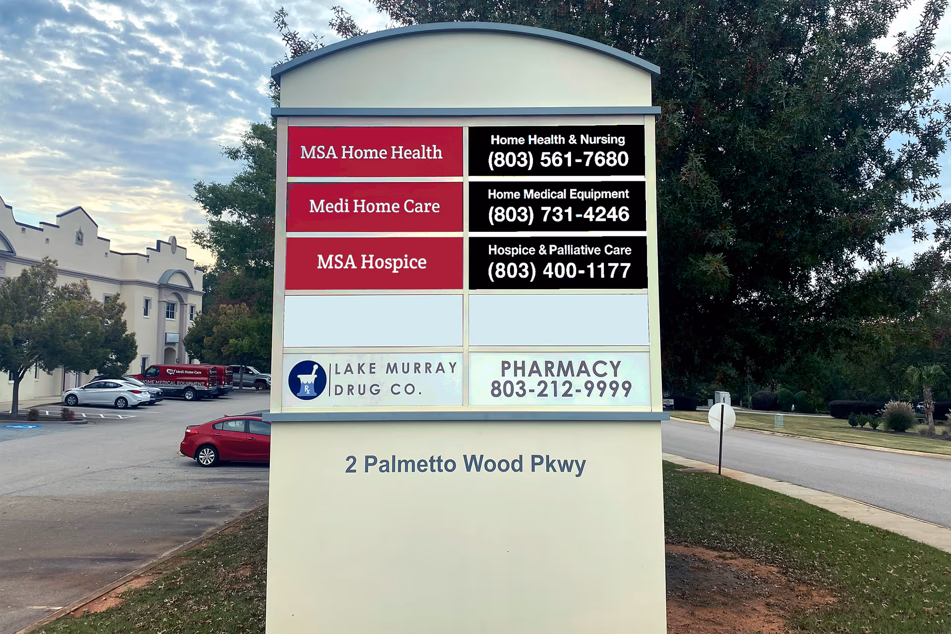 Large outdoor sign listing MSA Home Health and other services near a building.