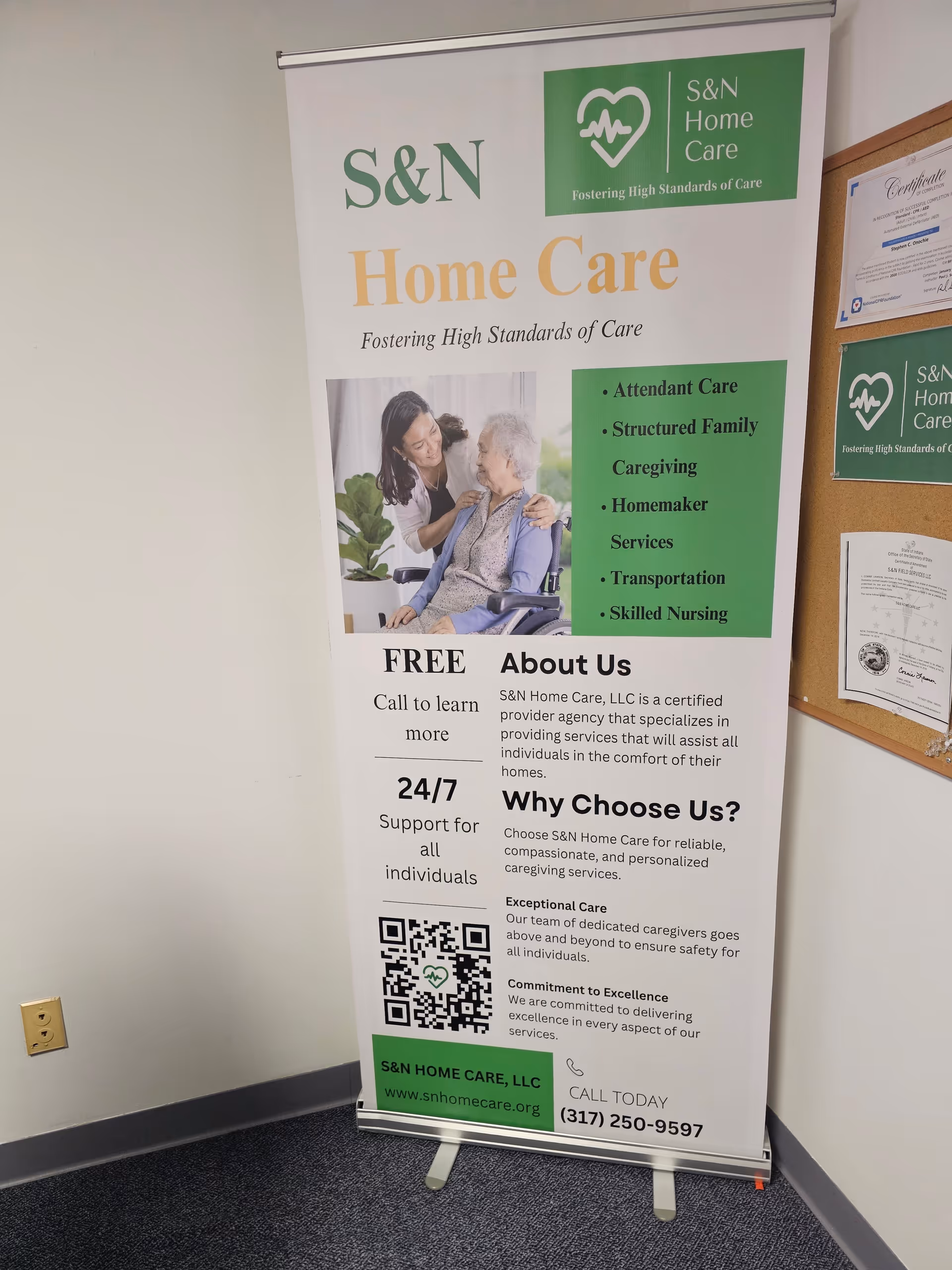 Indoor banner for S&N Home Care showing a caregiver with an elderly client.