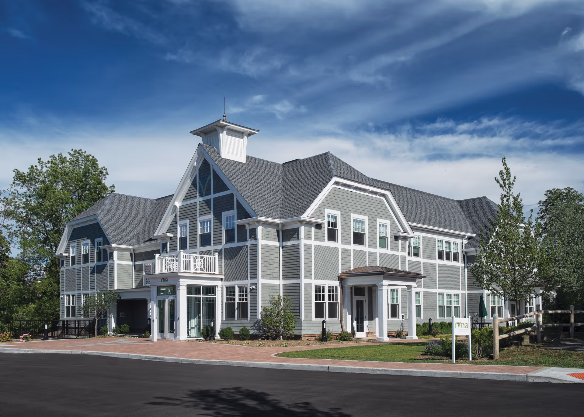 Exterior view of a large RVNAhealth senior care building with a welcoming entrance
