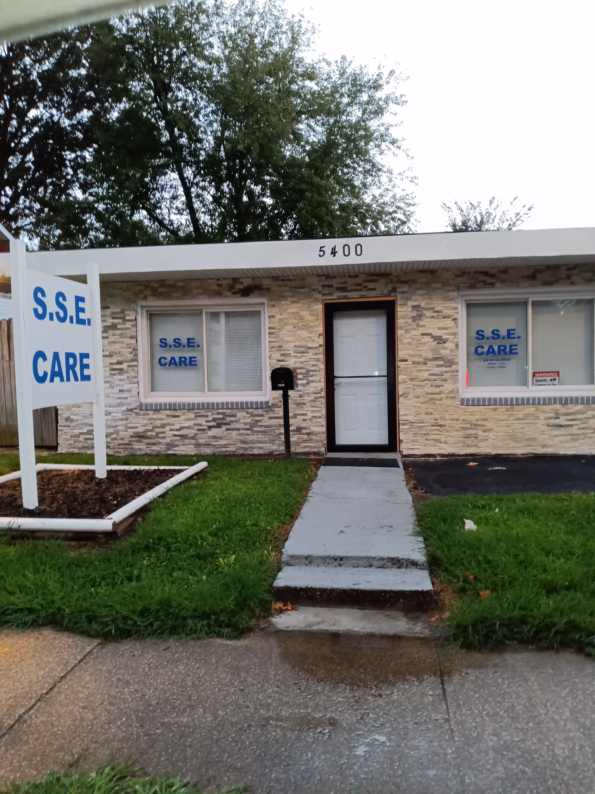 Front view of S.S.E. CARE facility exterior with sign and entrance