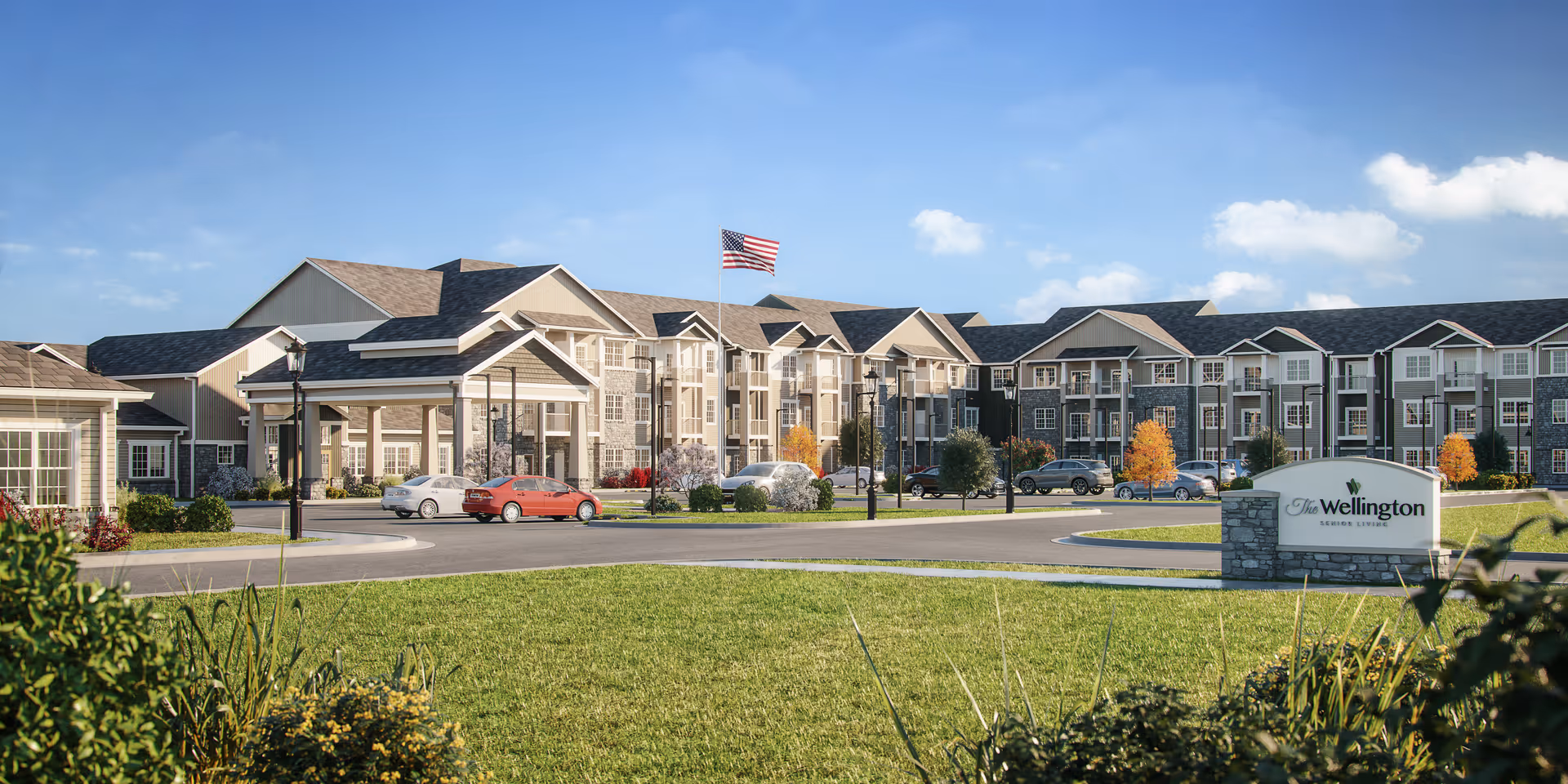 Exterior view of The Wellington Senior Living campus with sign and parked cars.