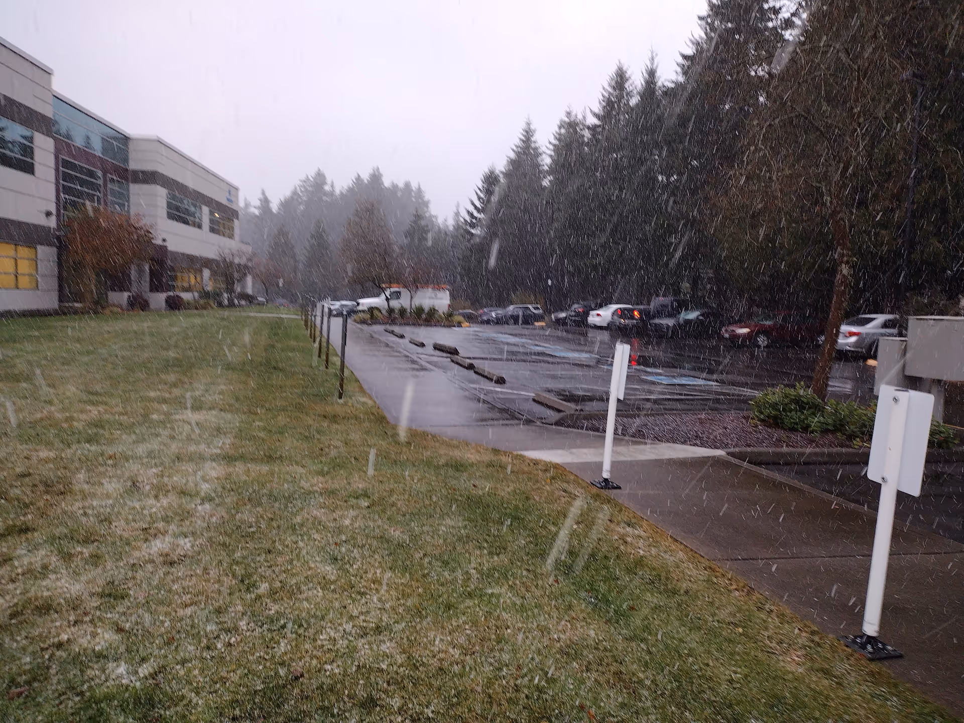 Exterior view of CDWA senior living facility with parking lot and snowy weather.