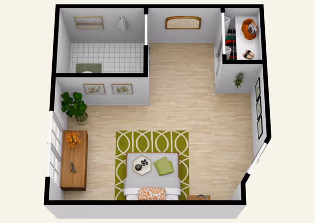 3D floor plan of a senior living studio with living area, bed, and bathroom.