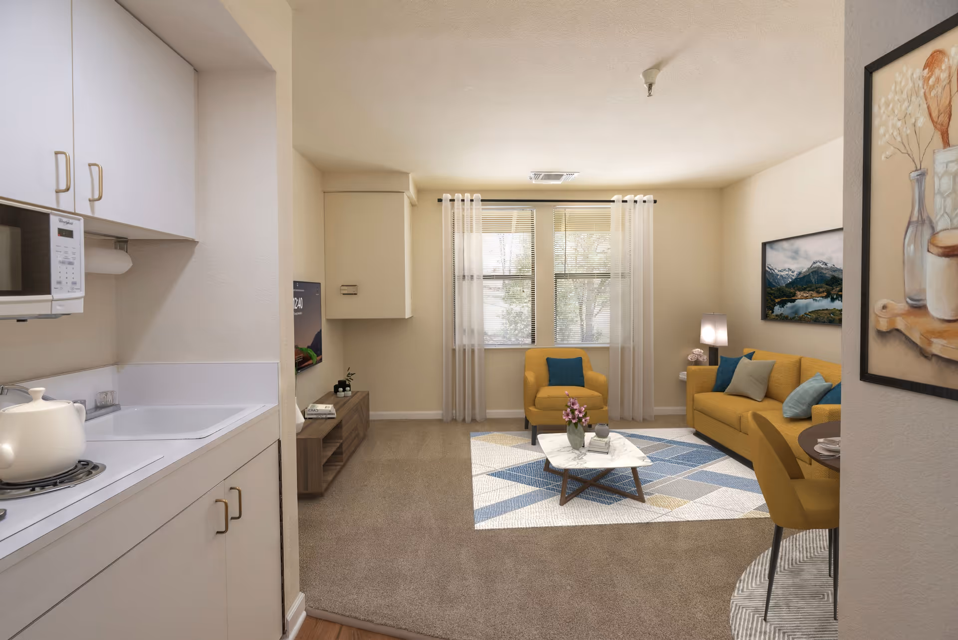 Cozy senior living room with yellow seating, a coffee table, and a kitchenette on the left.